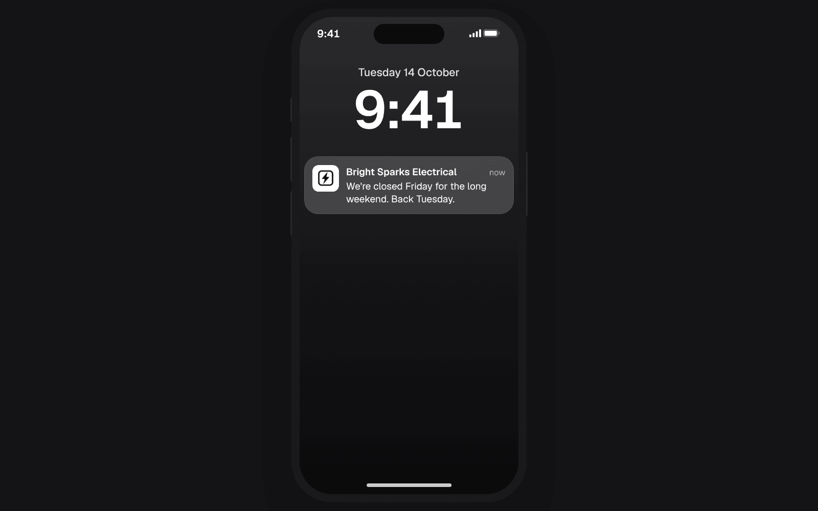 An iPhone lock screen showing a message from Bright Sparks Electrical saying the business is closed Friday for the long weekend
